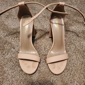 Tan open toe heels.